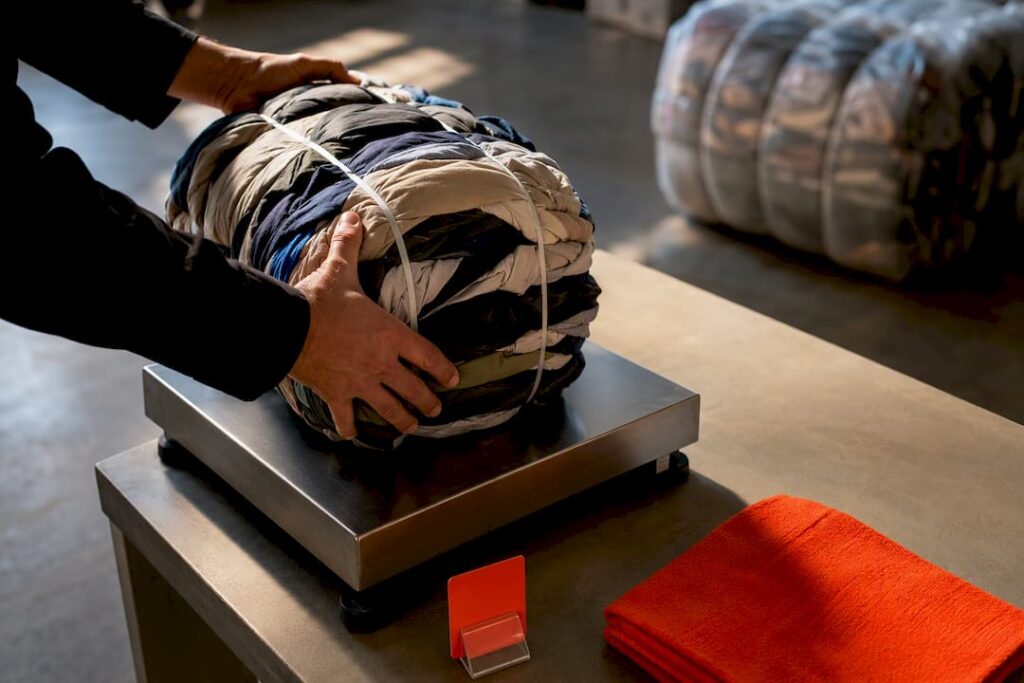 Anonymous used garments being weighed