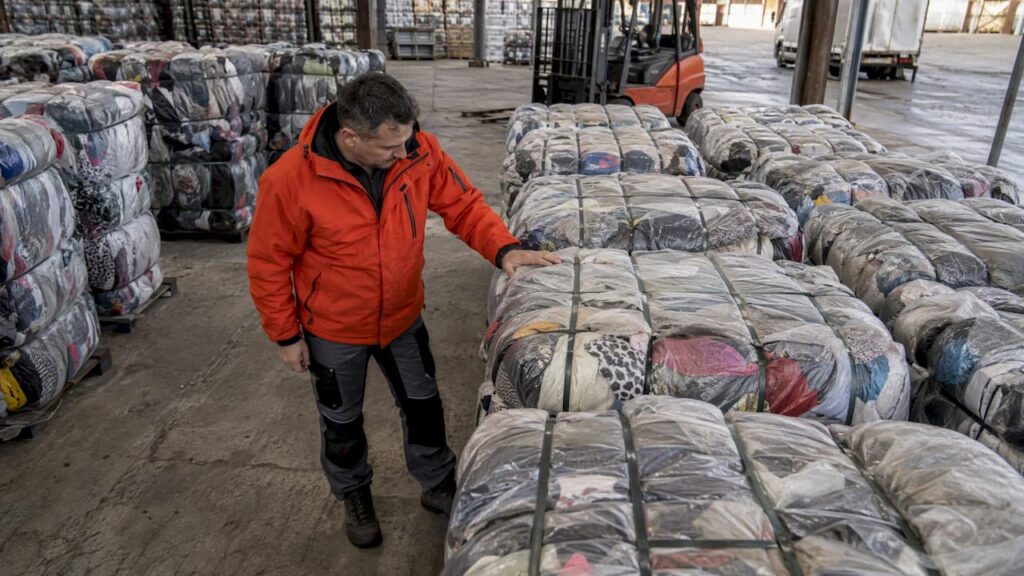 Buyer selects a bale for clothing inspection